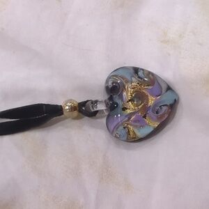 Artist stamped Italian glass purple and gold heart necklace on ribbon chain.